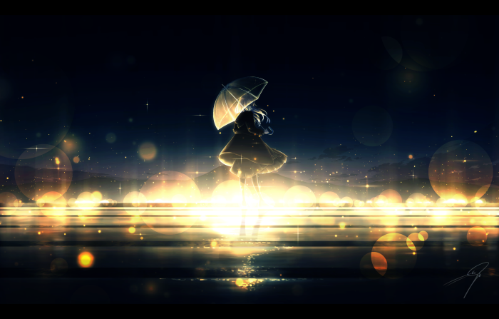 Girl with umbrella at night with bokeh lights
