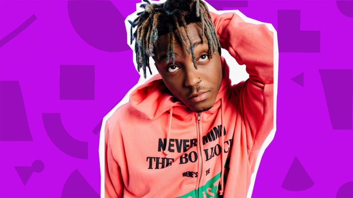 Juice WRLD wearing a pink hoodie