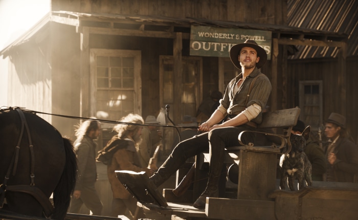 Man in a wagon in a Western town