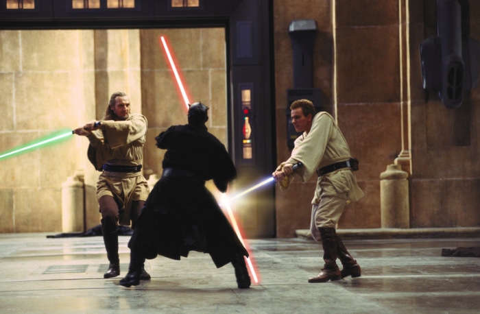 Qui-Gon Jinn, Obi-Wan Kenobi, and Darth Maul duel with lightsabers in Star Wars: The Phantom Menace