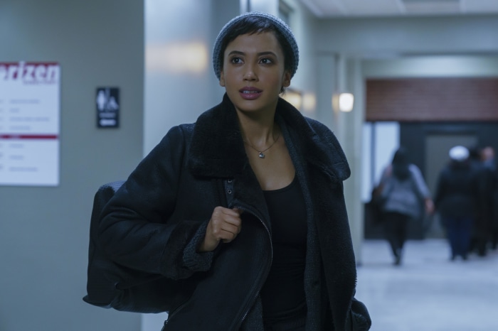 Andy Allo wearing a beanie and coat