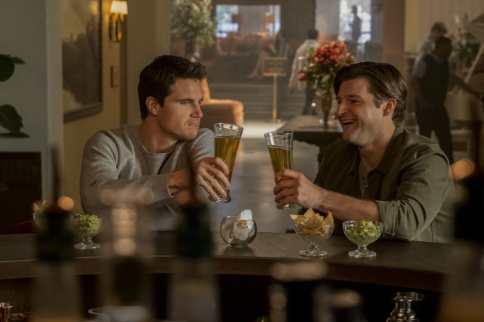 Robbie Amell and Kevin Bigley at a bar