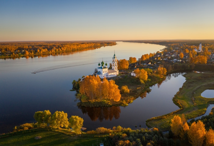 Church on the river bank in autumn, Russia