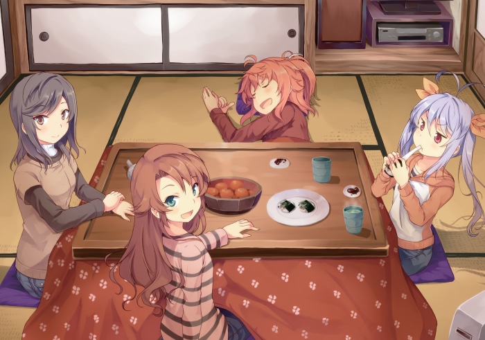 Non Non Biyori characters eating at a kotatsu