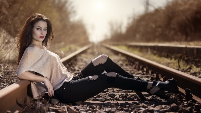 Brunette Model Posing on Train Tracks