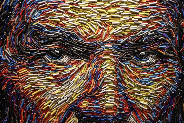 Close-up of a face made of colorful wires