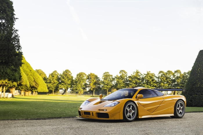 Orange McLaren F1 LM supercar parked on gravel