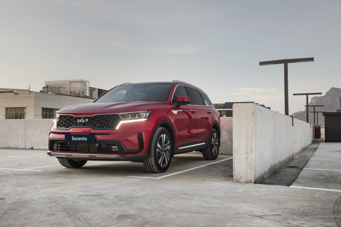 Red Kia Sorento SUV parked in a lot