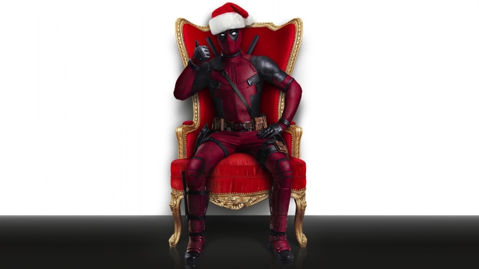 Deadpool in Santa Hat Sitting on Throne 4K