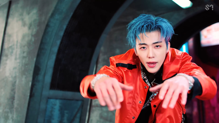 NCT's Jaemin in a red jacket