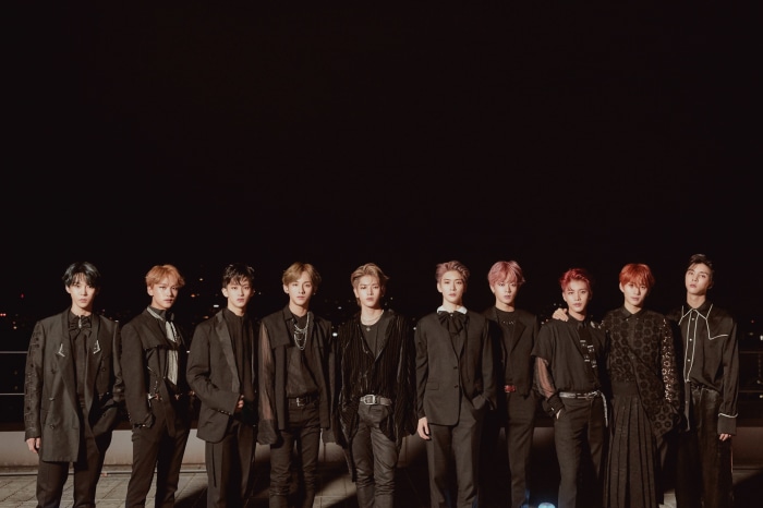 NCT members posing for a group photo