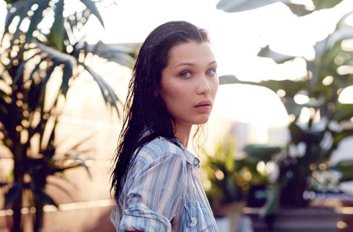 Bella Hadid in a striped shirt outdoors