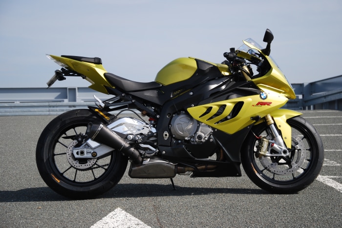 Yellow BMW S1000RR motorcycle parked outdoors