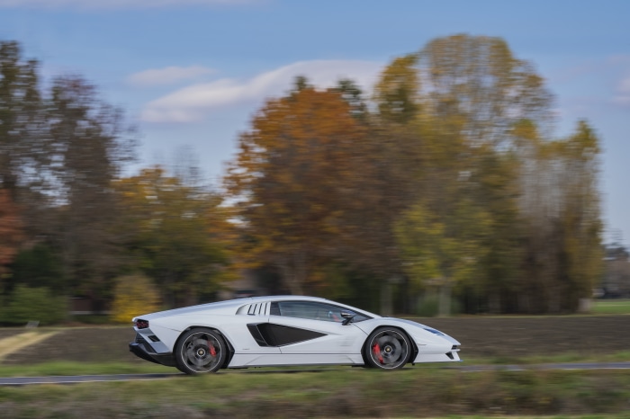 White Lamborghini Countach LPI 800-4 driving on road