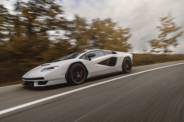 White Lamborghini Countach LPI 800-4 driving on a road