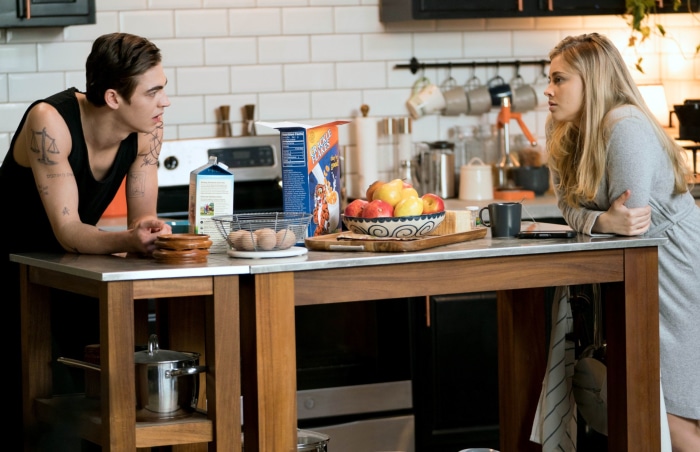 Hero Fiennes Tiffin and Josephine Langford in kitchen
