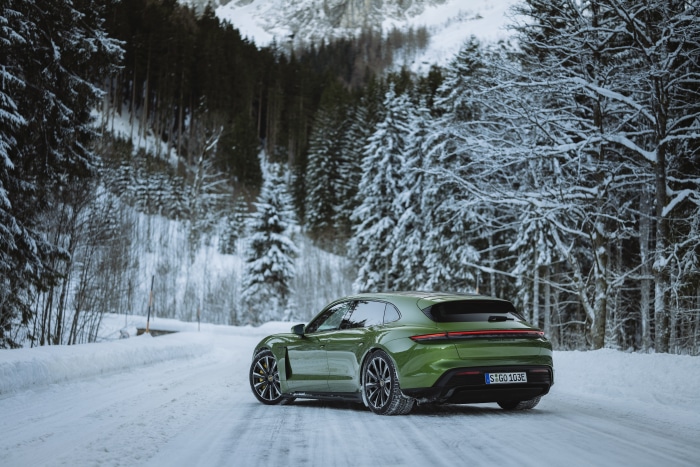 Green Porsche Taycan Turbo S in Snowy Forest