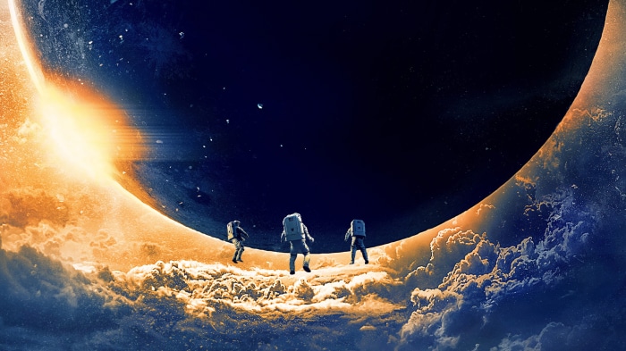 Astronauts on a celestial body with a bright light source