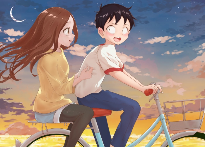Takagi and Nishikata riding a bicycle at sunset