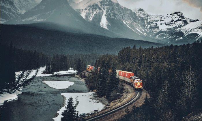 Train traveling through a snowy mountain landscape