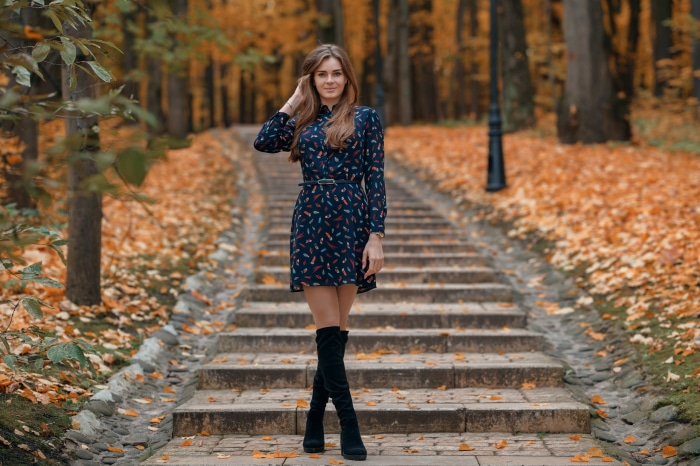 Brunette Model Poses on Autumn Park Steps
