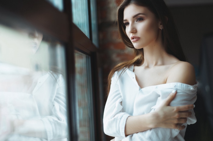 Brunette Model Posing by Window