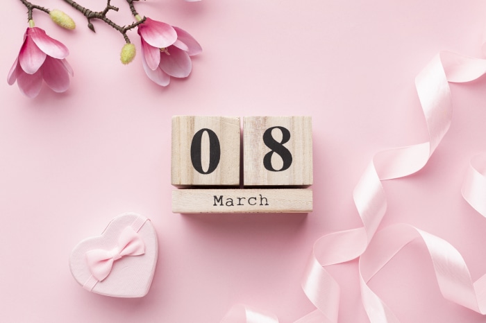 Wooden Calendar Blocks Showing March 8th with Flowers and Gift