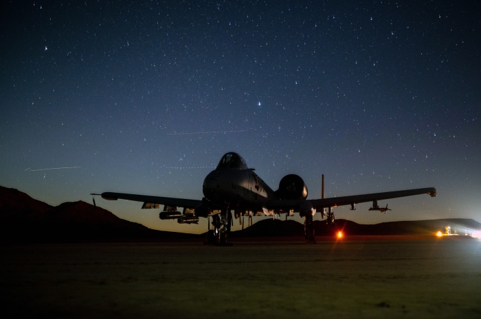 A-10 Thunderbolt II aircraft at night under stars
