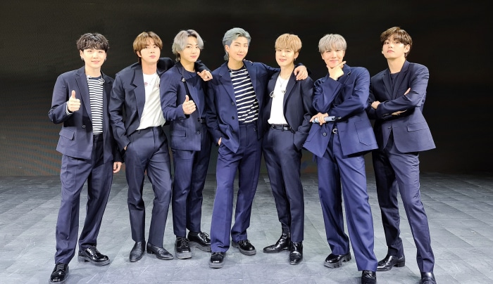 BTS members in navy suits