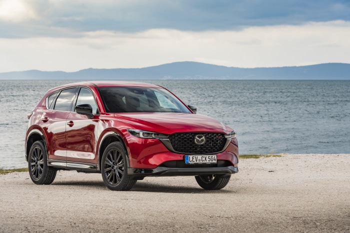 Red Mazda CX-5 Skyactiv-D 4K SUV on beach