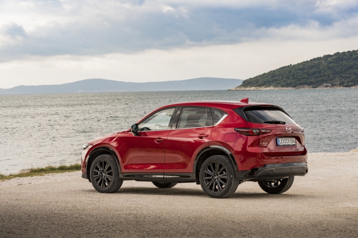 Red Mazda CX-5 Skyactiv-D 4K parked by the sea