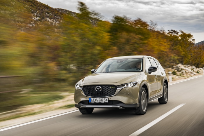 Mazda CX-5 Skyactiv-D 4K SUV driving on a road