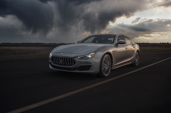 Silver Maserati Ghibli GT Hybrid driving on a road