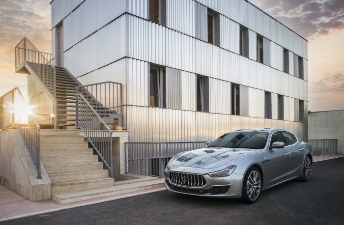Maserati Ghibli GT Hybrid parked by modern building