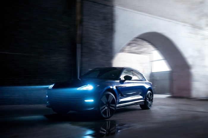 Blue Aston Martin DBX707 SUV driving through tunnel