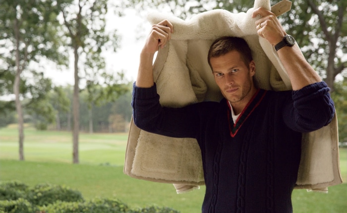 Tom Brady wearing a sweater and shearling coat