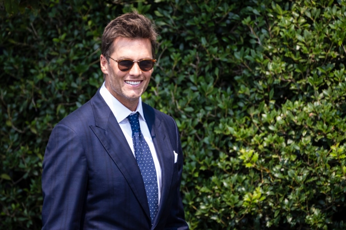 Tom Brady in a suit and sunglasses