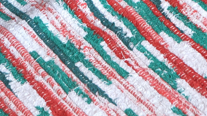 Abstract diagonal stripes of red, white, and green