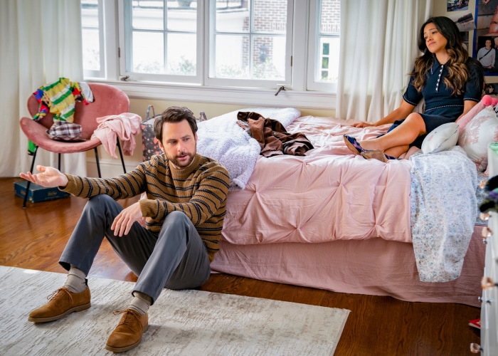 Charlie Day and Gina Rodriguez in a bedroom