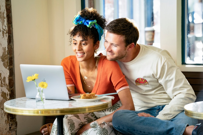 Clark Backo and Scott Eastwood looking at a laptop