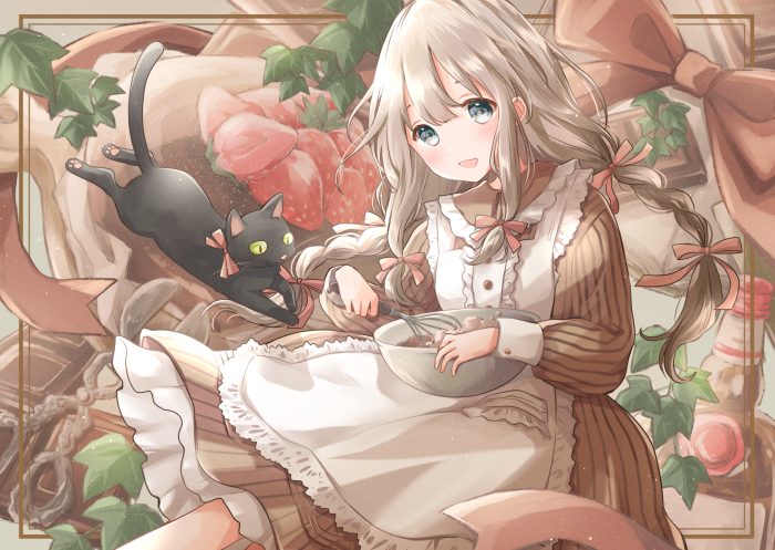 Girl baking with a black cat and strawberries