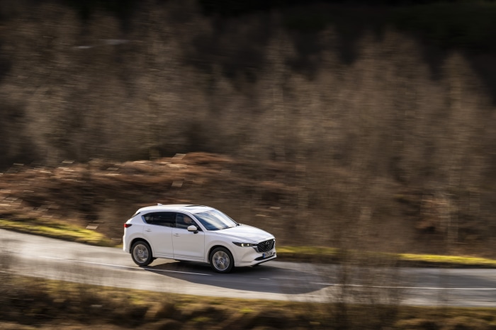 White Mazda CX-5 Skyactiv-D AWD GT Sport driving on a road