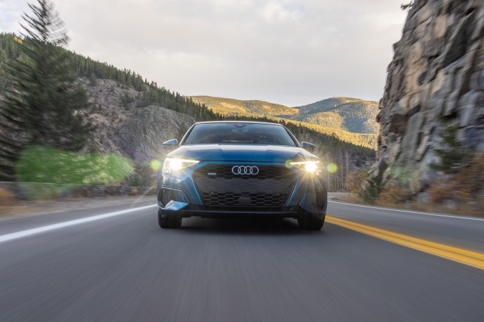 Blue Audi A3 Sedan 40 TFSI quattro driving on mountain road