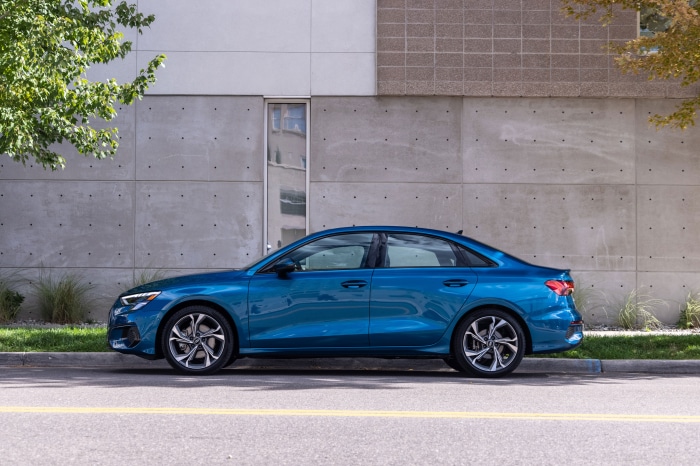 Blue Audi A3 Sedan 40 TFSI quattro parked by a building