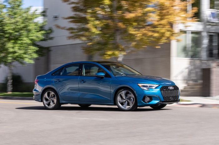 Blue Audi A3 Sedan 40 TFSI quattro driving on street