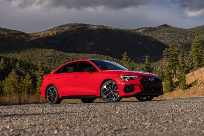 Red Audi A3 Sedan on a mountain road