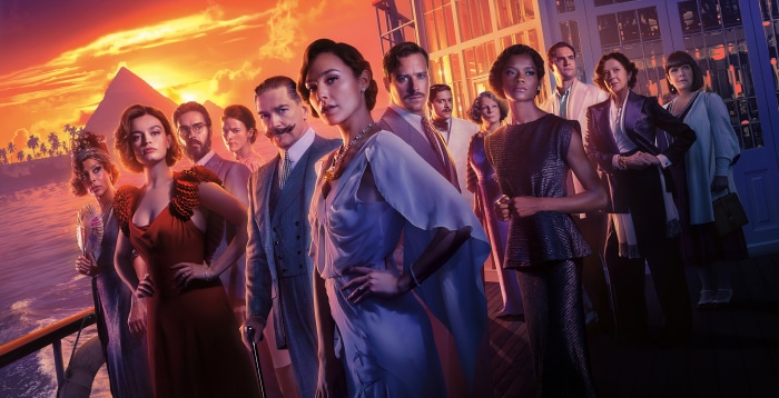 Death on the Nile cast with pyramids in background