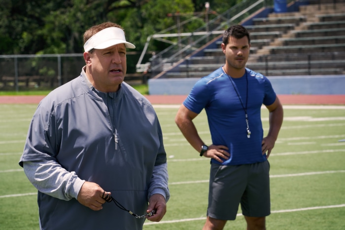 Kevin James and Taylor Lautner on a football field