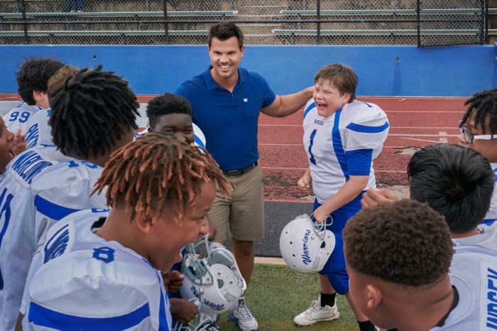 Taylor Lautner with young football team