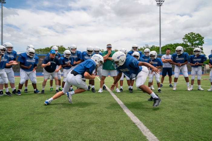 Football team practice with Kevin James